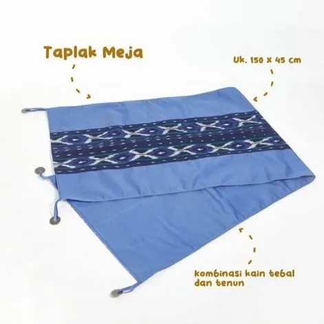 Taplak meja biru muda dengan pita tenun biru tua di tengah dan keterangan ukuran 150 x 45 cm